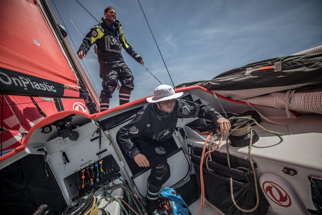 Leg 8 from Itajai to Newport, day 15 on board Dongfeng. 06 May, 2018. Charles Caudrelier stacking while Jackson gets out of the hatch, ready to help. (Photo © Jeremie Lecaudey/Volvo Ocean Race)