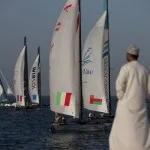 The fleet racing close to the shore 