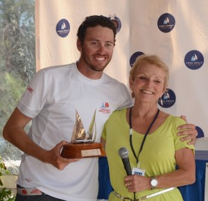 Taylor Canfield won the Match Racing Association's 2nd annual Jordy Walker Trophy as the most improved young match race sailor who competes in Alpari World Match Racing Tour events or other events that automatically qualify a skipper for a Tour event. Mary Walker made the presentation at the 2012 Argo Group Gold Cup prizegiving at the Royal Bermuda Yacht Club. (Photo by Talbot Wilson)
