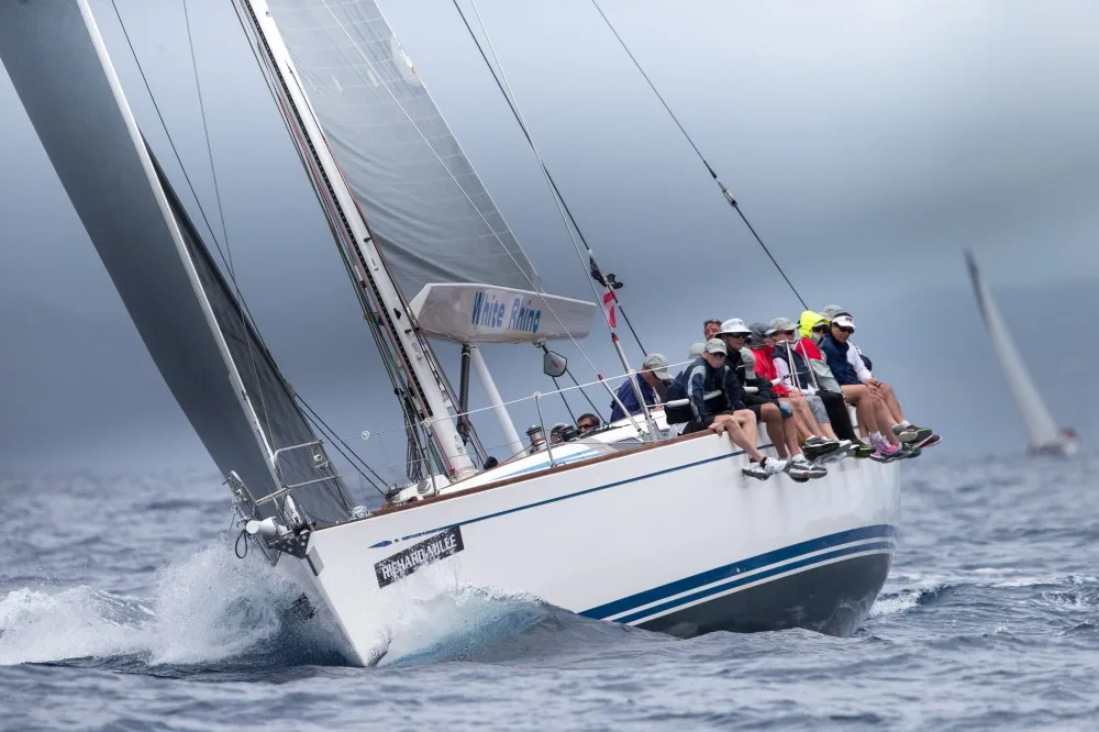 Les Voiles de St. Barth Christophe Jouany Stark Raving Mad racing through the squalls in the Spinnaker 1 Class at Les Voiles de St. Barth