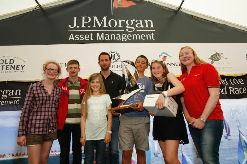 The 2014 Raymarine RIR Young Sailor Trophy was awarded to Christopher Barker from Surrey, who was joined on stage by his siblings, Sir Ben Ainslie and Corrie McQueen from J.P. Morgan Asset Management. Photo: Patrick Eden